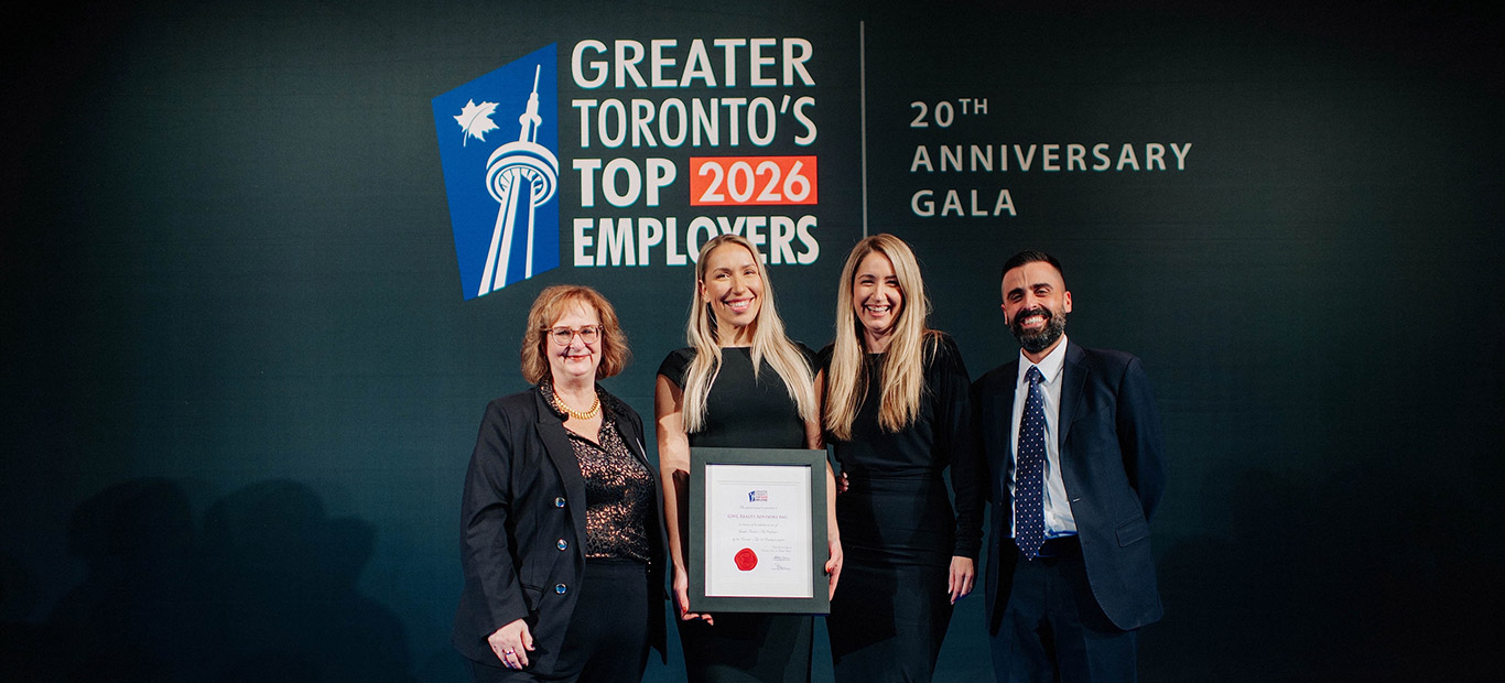 A group of four people accepting the 2026 Greater Toronto's Top Employers award on behalf of GWLRA.